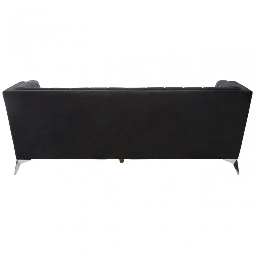 Back view of modern black velvet sofa with chrome legs on white background