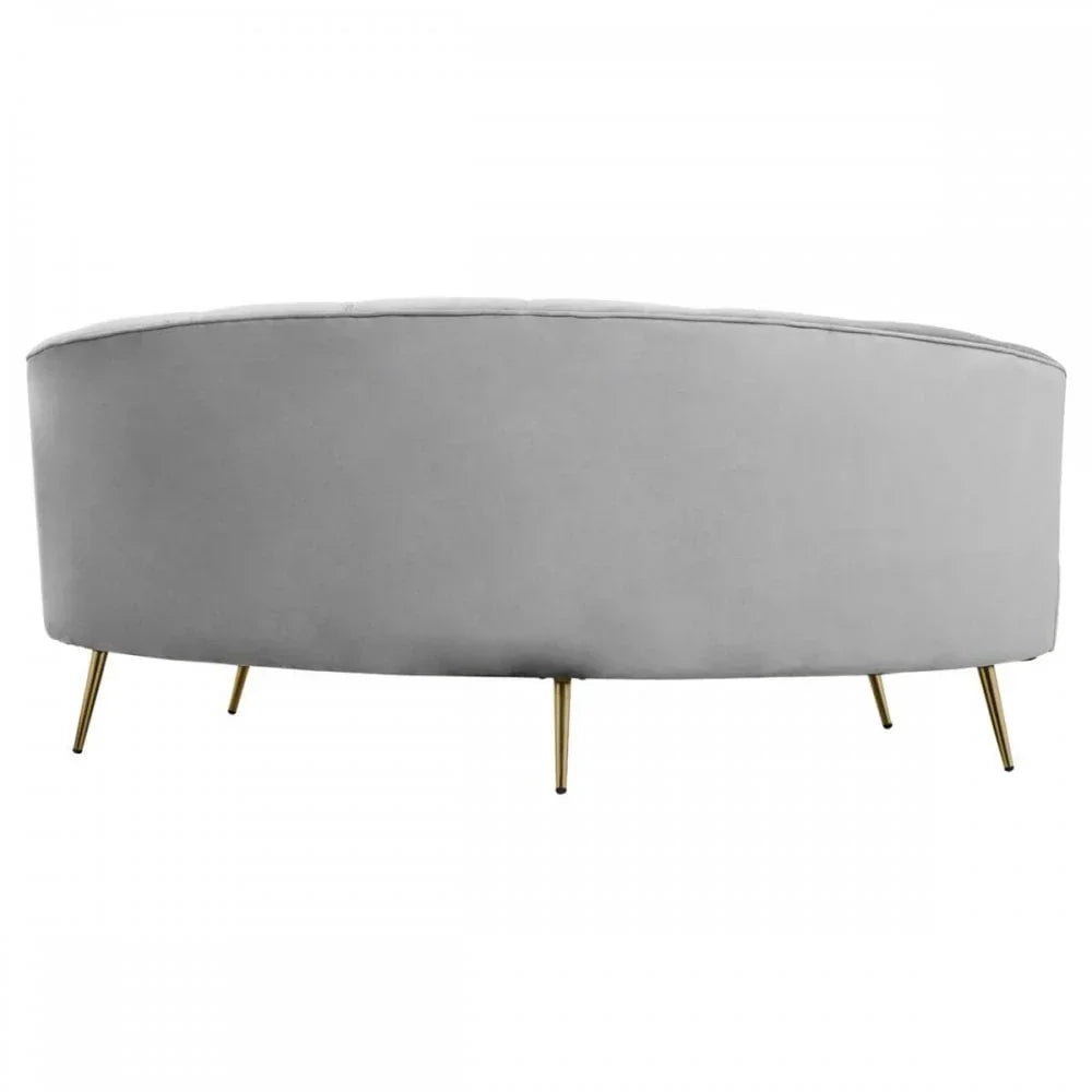 Curved grey velvet sofa with gold metal legs, rear view