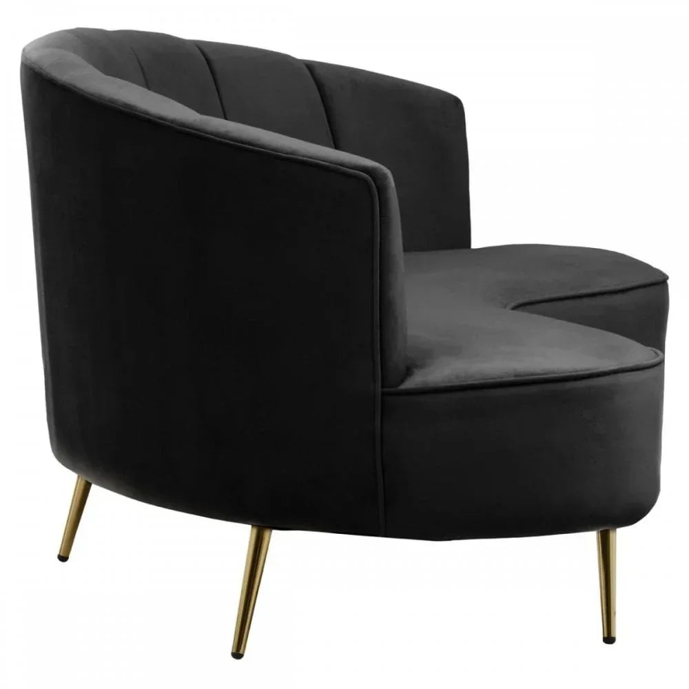 Modern black velvet accent chair with gold metal legs and curved backrest