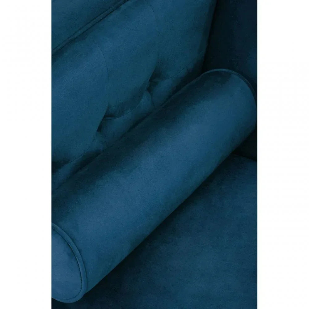 Close-up of blue velvet sofa cushion and tufted backrest upholstery