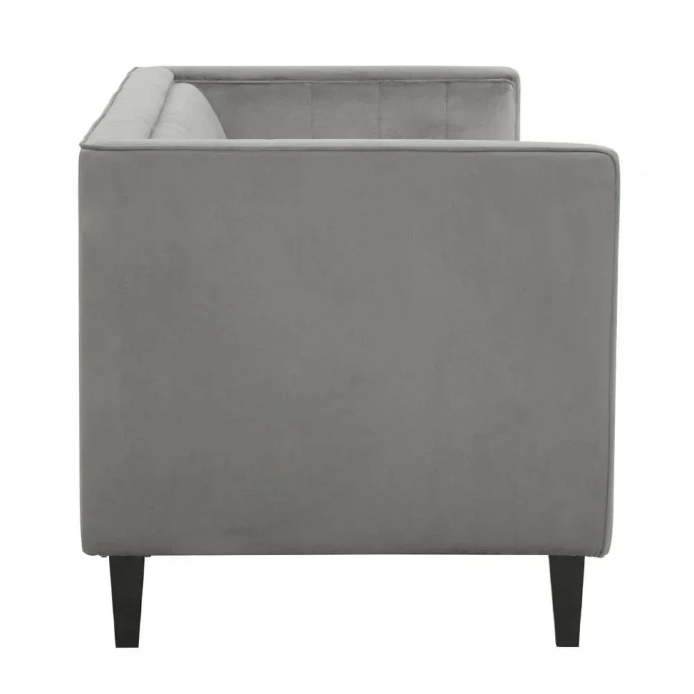 Side view of grey fabric sofa with black tapered legs