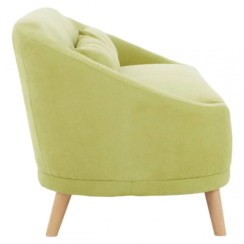 Side view of green fabric armchair with wooden legs and cushioned backrest