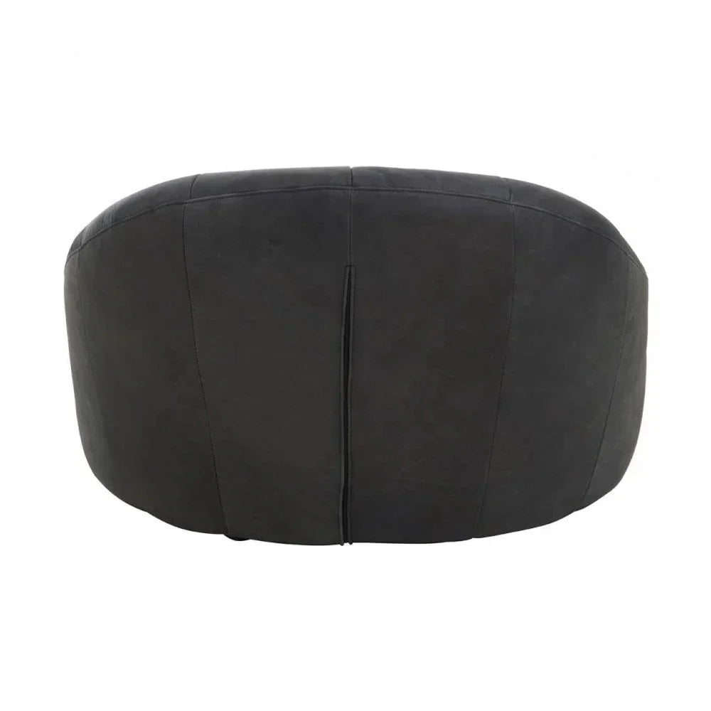 Rear view of black fabric armchair with curved backrest and vertical seam detail