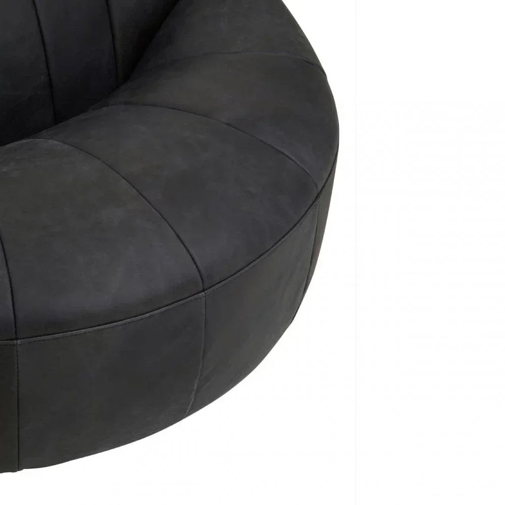 Curved black fabric sofa seat section with stitched panels, close-up view