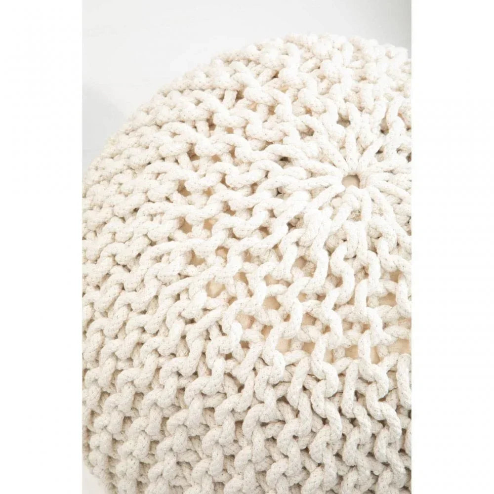 Closeup of cream chunky knit pouffe texture with woven cotton material