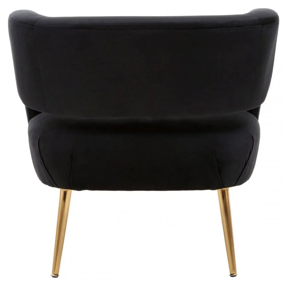 Black velvet accent chair with gold legs, rear view highlighting curved backrest