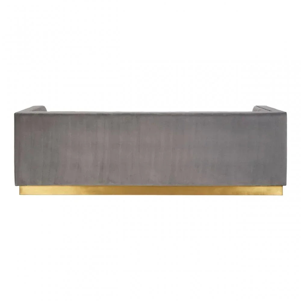 Back view of grey velvet sofa with gold metal base