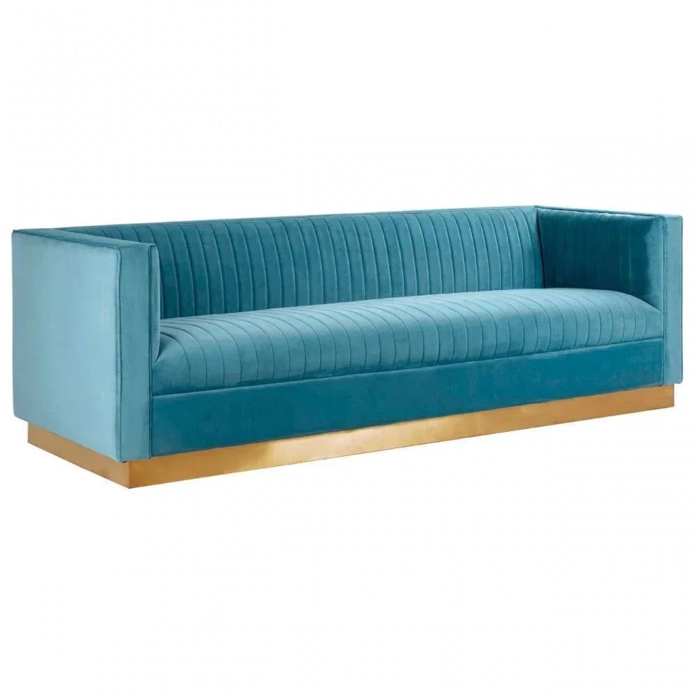 Turquoise velvet sofa with gold base and vertical stitched detailing on seat and backrest