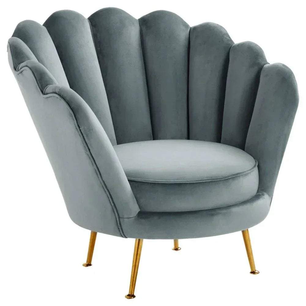 Grey velvet accent chair with scalloped backrest and gold metal legs