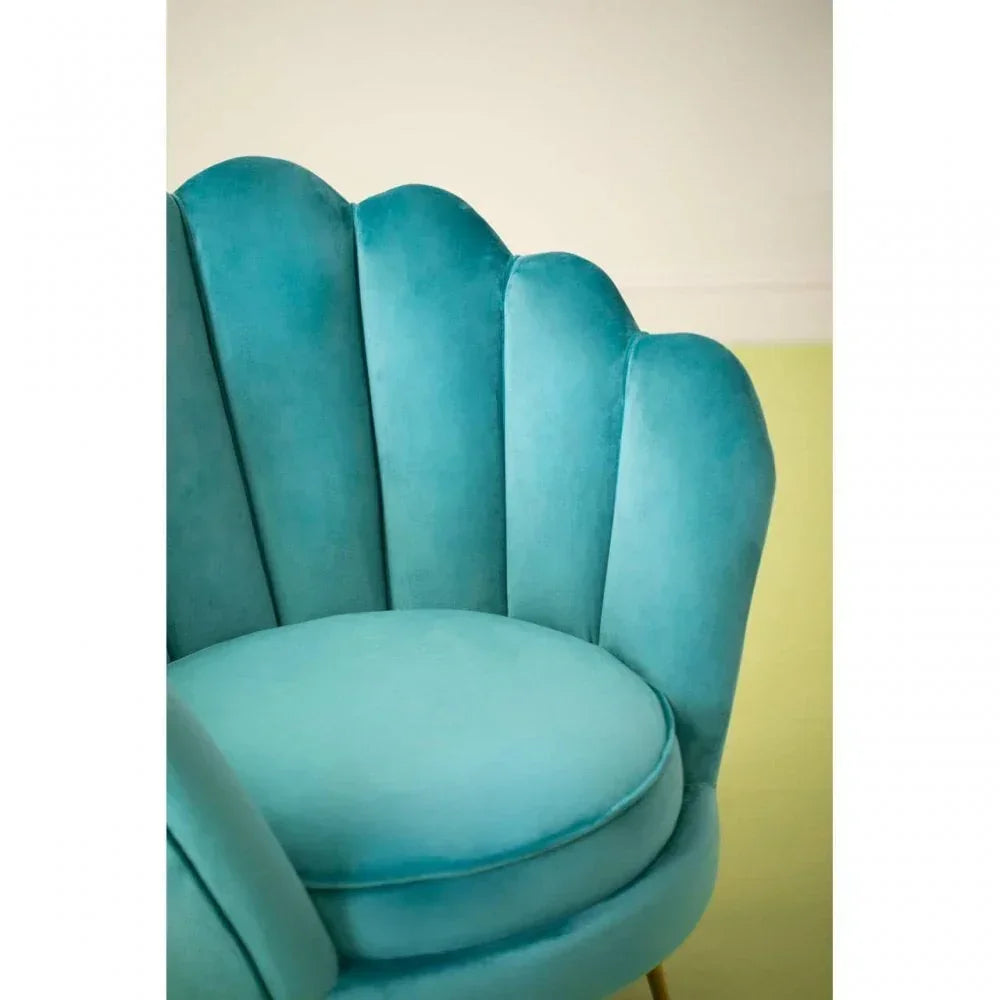 Teal velvet accent chair with scalloped backrest and round seat cushion
