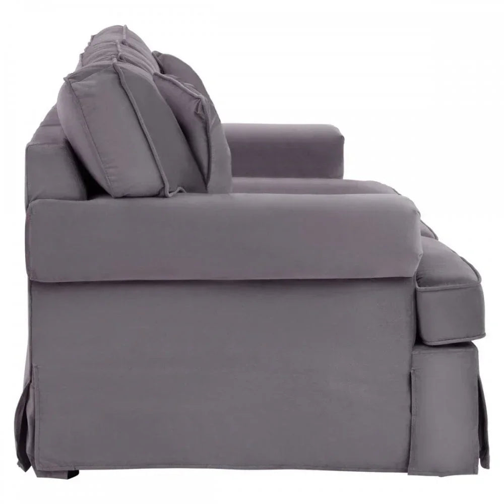 Side view of grey fabric sofa with plush cushions and wide armrest