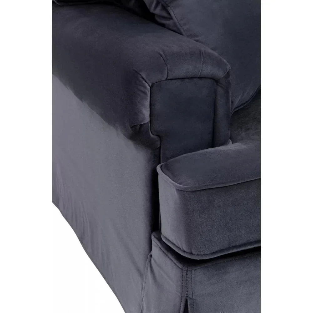 Close-up of dark grey fabric sofa armrest and seat cushion