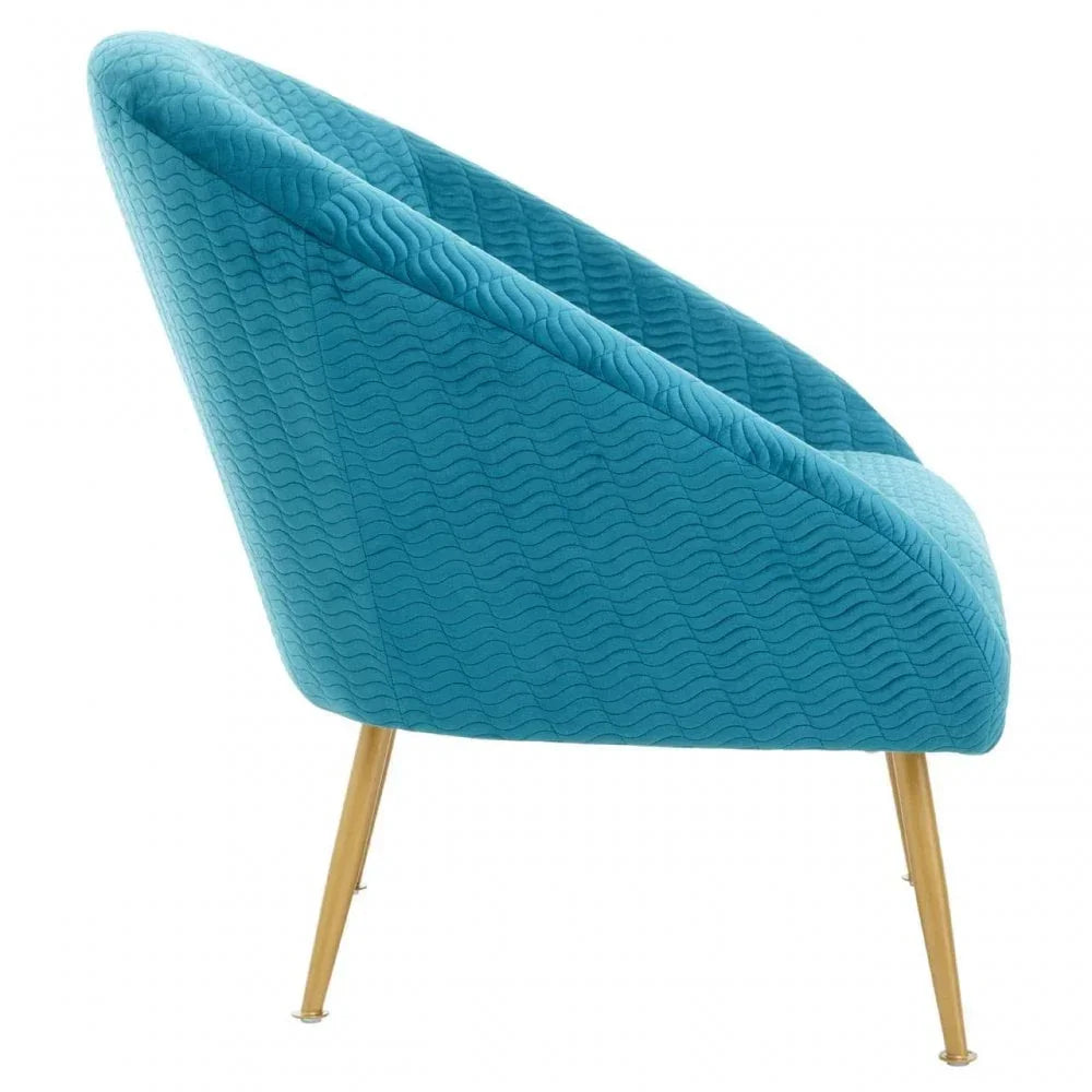 Blue accent chair with wave pattern upholstery and gold angled legs, side view