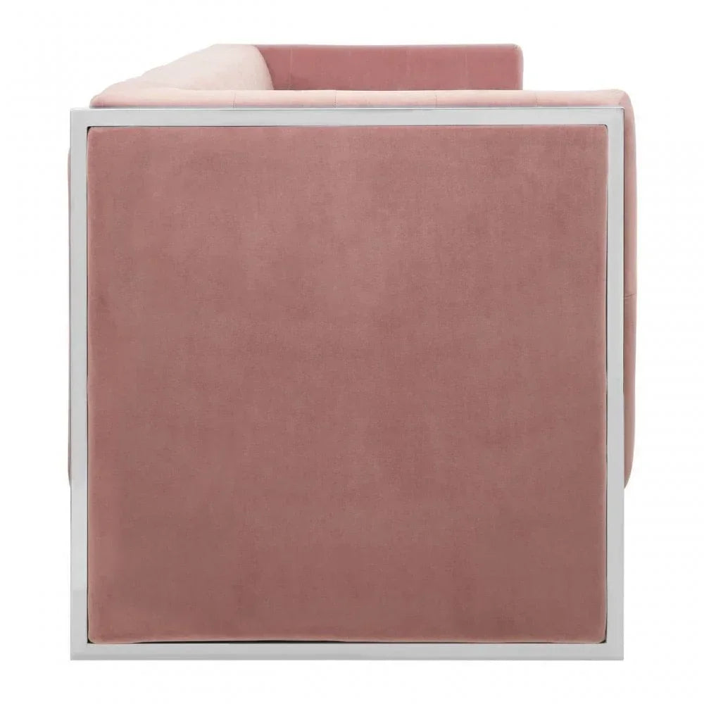 Side view of pink velvet armchair with white metal frame and square design