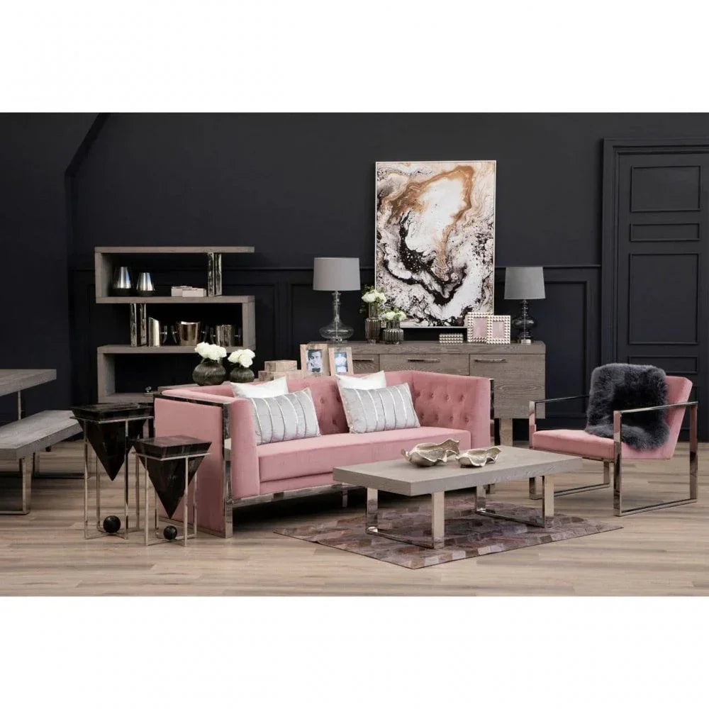Pink velvet sofa set with metal frame, coffee table, and shelving in modern living room