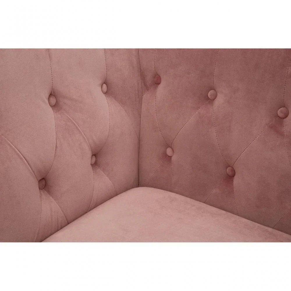 Blush pink velvet sofa with button tufted backrest and corner seat detail