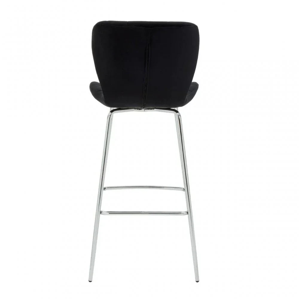 Black bar stool with chrome legs and curved backrest, rear view