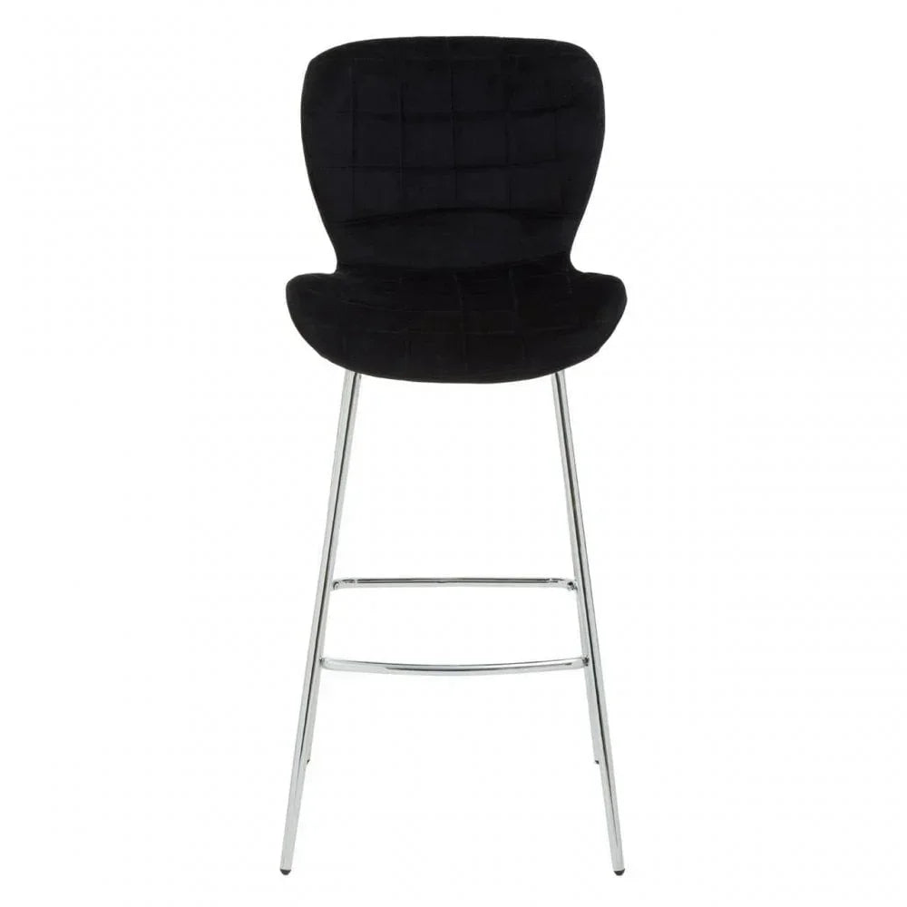 Black velvet bar stool with quilted backrest and chrome legs, front view