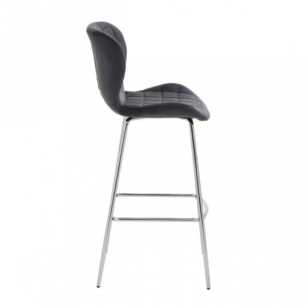 Grey bar stool with cushioned seat and chrome legs, side view