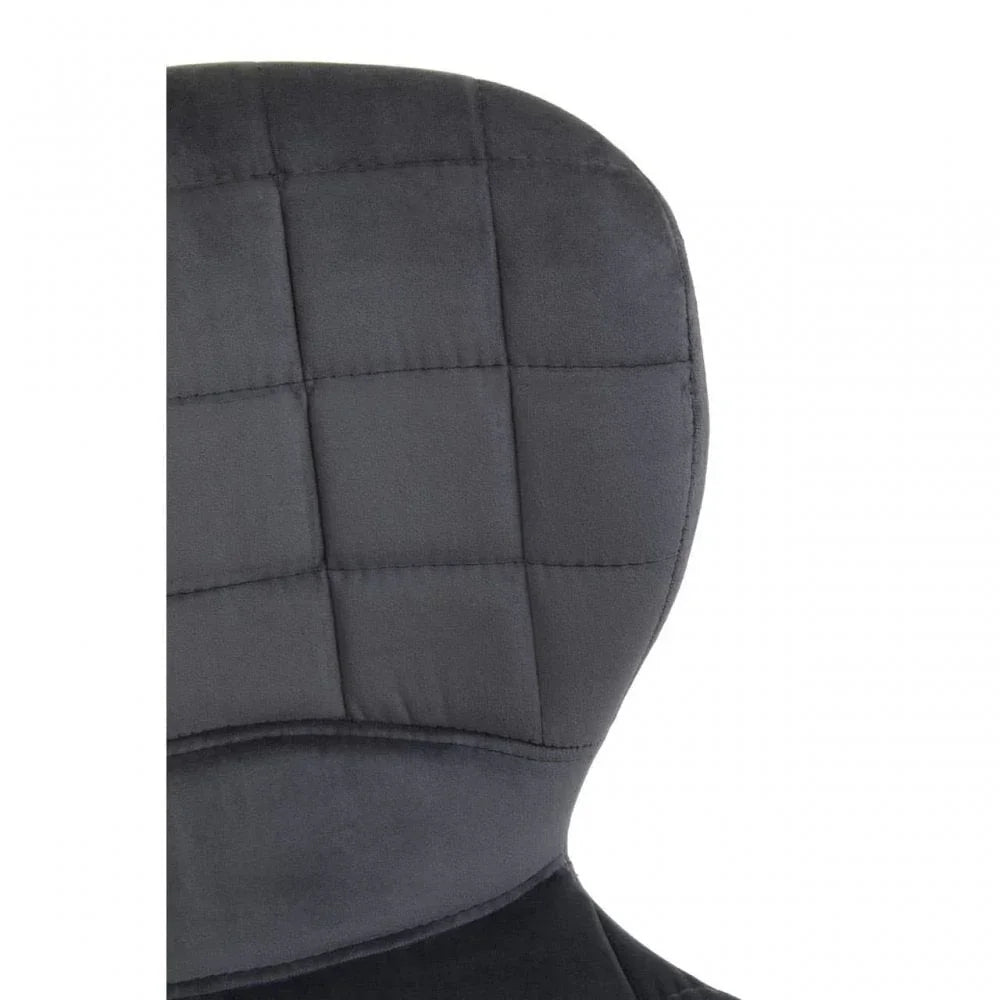 Closeup of dark grey fabric chair backrest with square stitched upholstery pattern