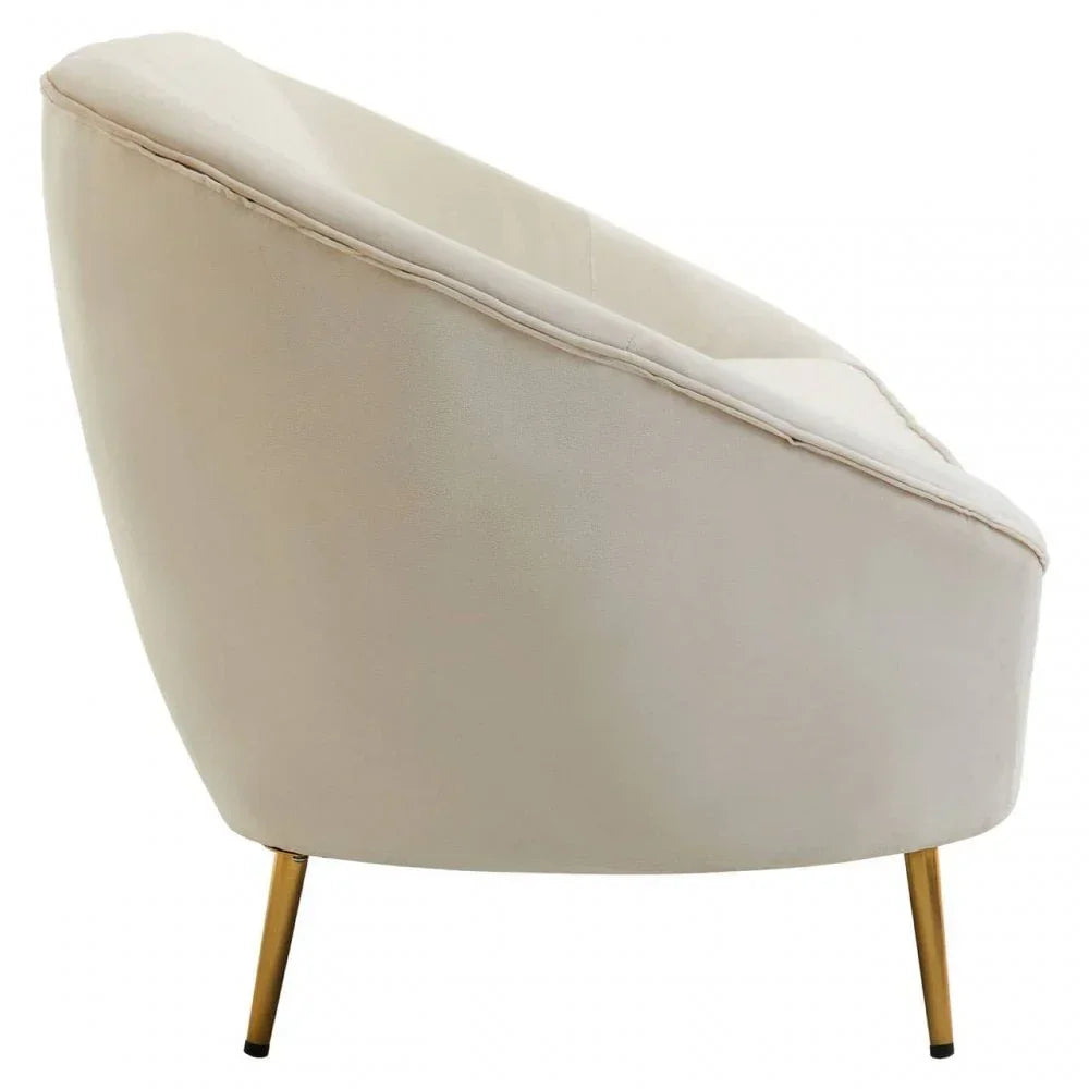Cream accent chair with gold metal legs, angled side view
