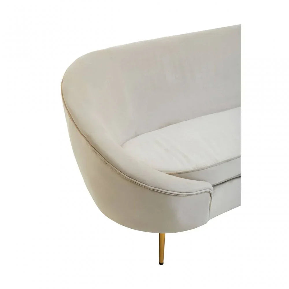 Curved cream fabric sofa with gold metal leg and soft cushioned seat, close-up angle