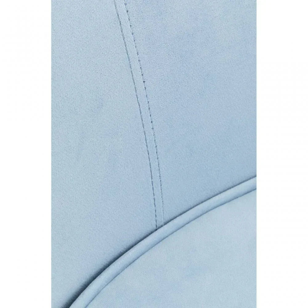 Light blue upholstered chair fabric closeup with seam detail