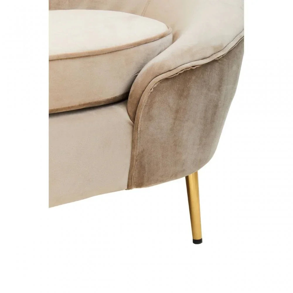 Beige velvet sofa corner with round cushion and gold metal leg detail