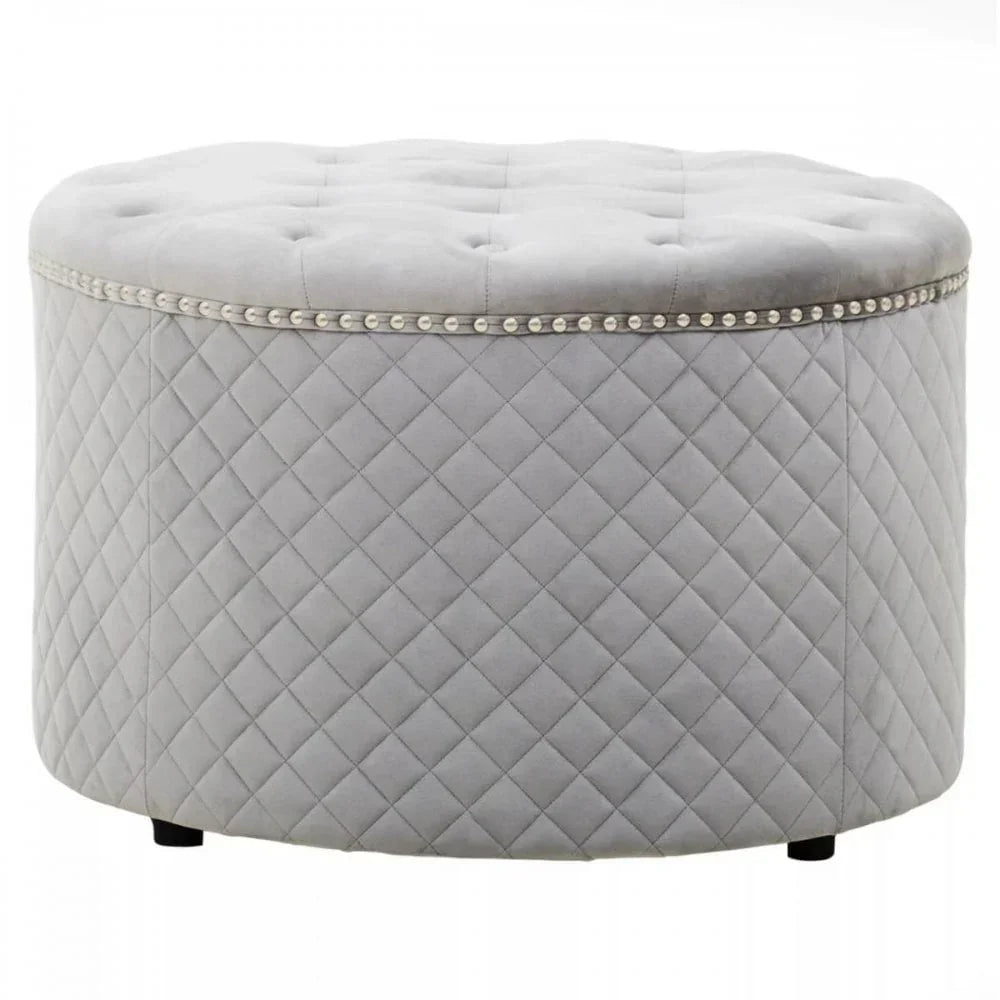 Grey velvet ottoman with tufted top and quilted diamond stitching, silver stud trim
