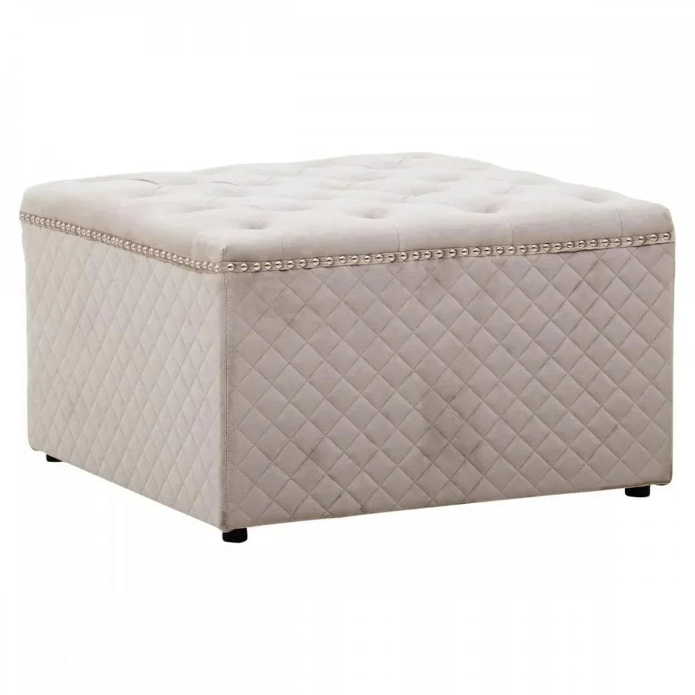 Beige upholstered ottoman with diamond quilted sides and stud detailing on top edge