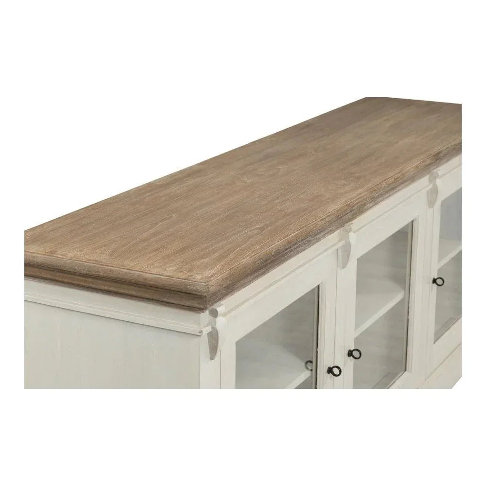 White sideboard with glass doors and natural wood top, angled close-up of surface detail