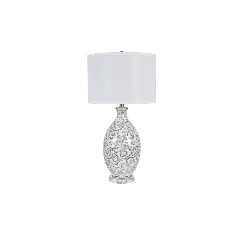 Ceramic table lamp with white patterned base and white cylindrical fabric shade