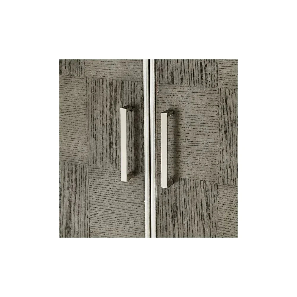 Closeup of modern cabinet doors with textured grey wood finish and metal handles