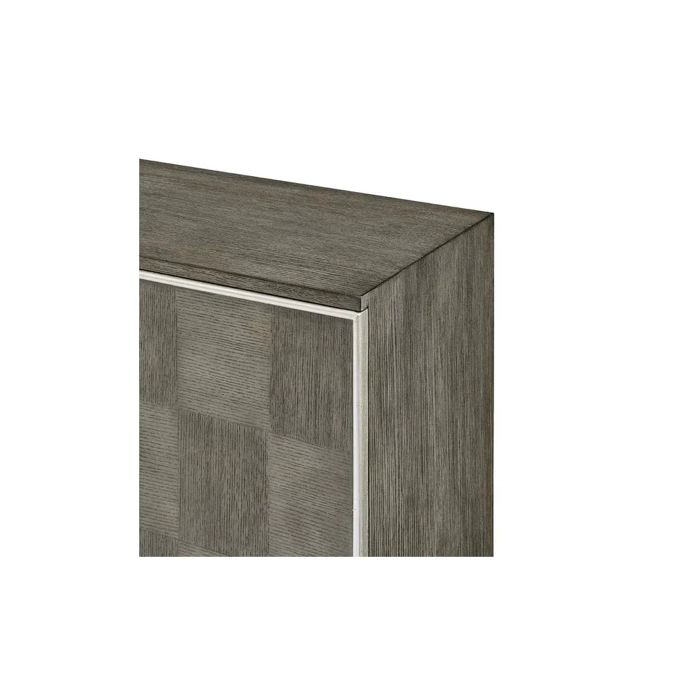Close-up of grey wood cabinet corner with textured checkerboard design and clean metal trim