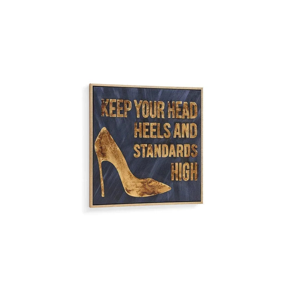 Gold high heel wall art with motivational quote on dark blue background