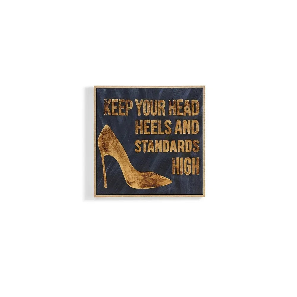 Gold high heel wall art with motivational quote on dark background