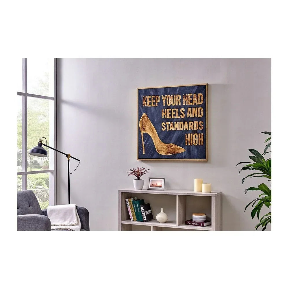 Modern living room with wall art showing high heel and motivational quote above bookcase
