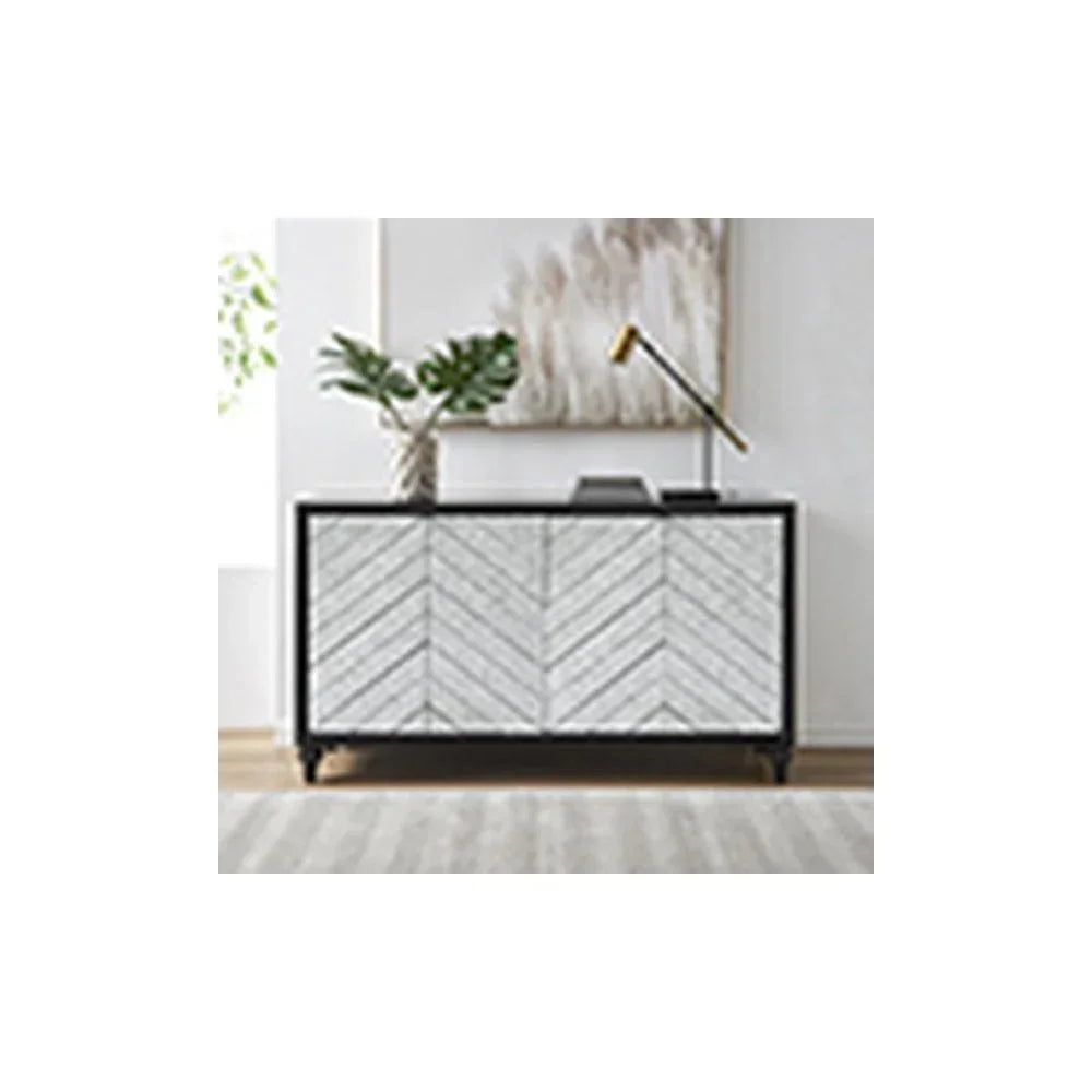 Chevron wood sideboard with black frame, gold desk lamp, and vase in modern living room