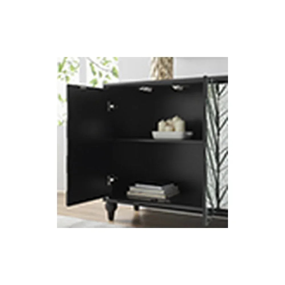 Black sideboard cabinet with open door, interior shelving, books and decor bowl visible