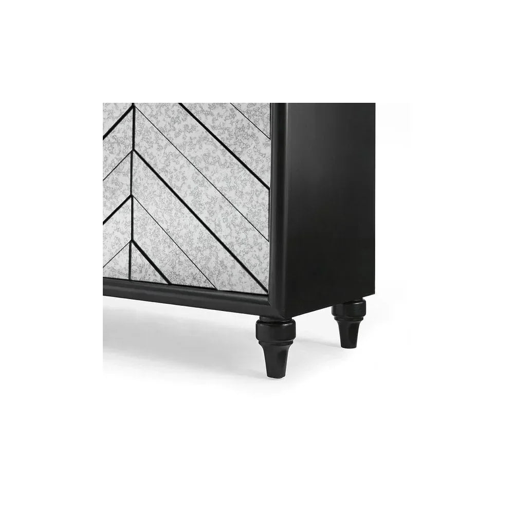 Black wooden sideboard with mirrored chevron panels and turned legs, corner detail view