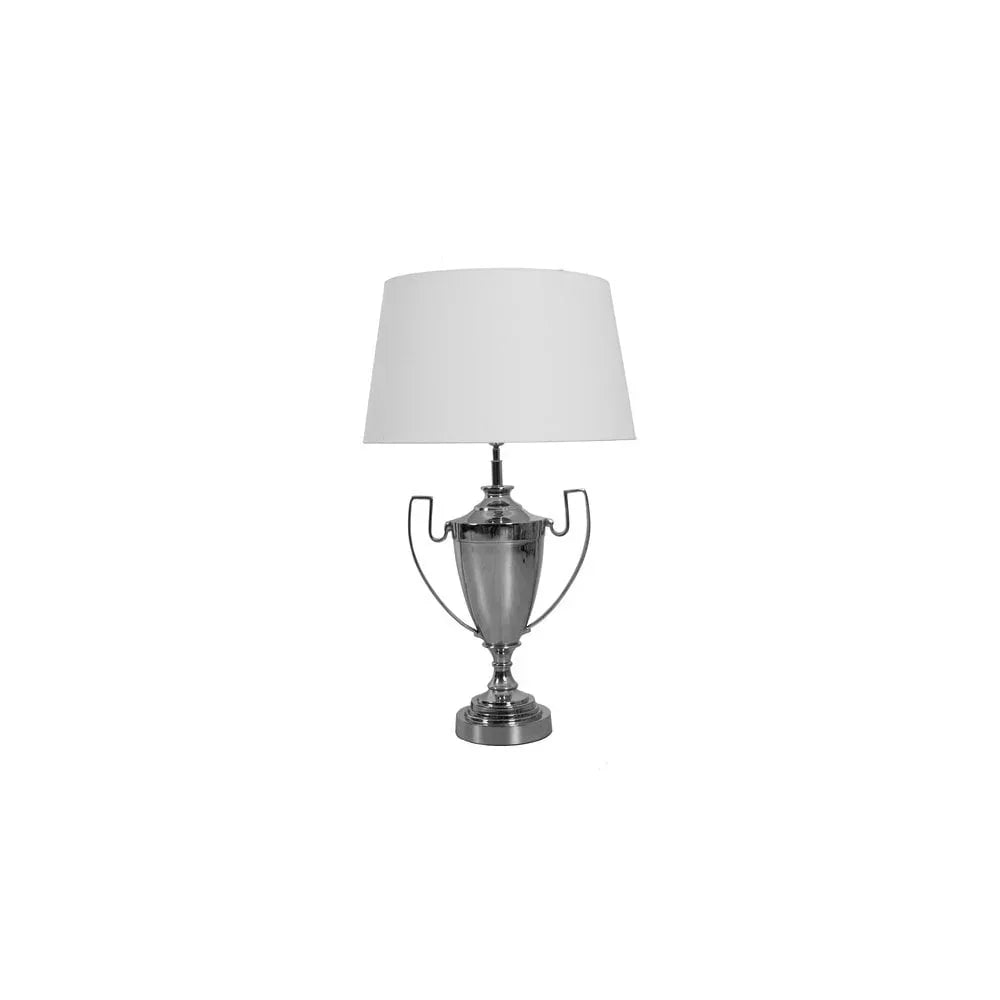Silver table lamp with urn-shaped base and white lampshade on plain background