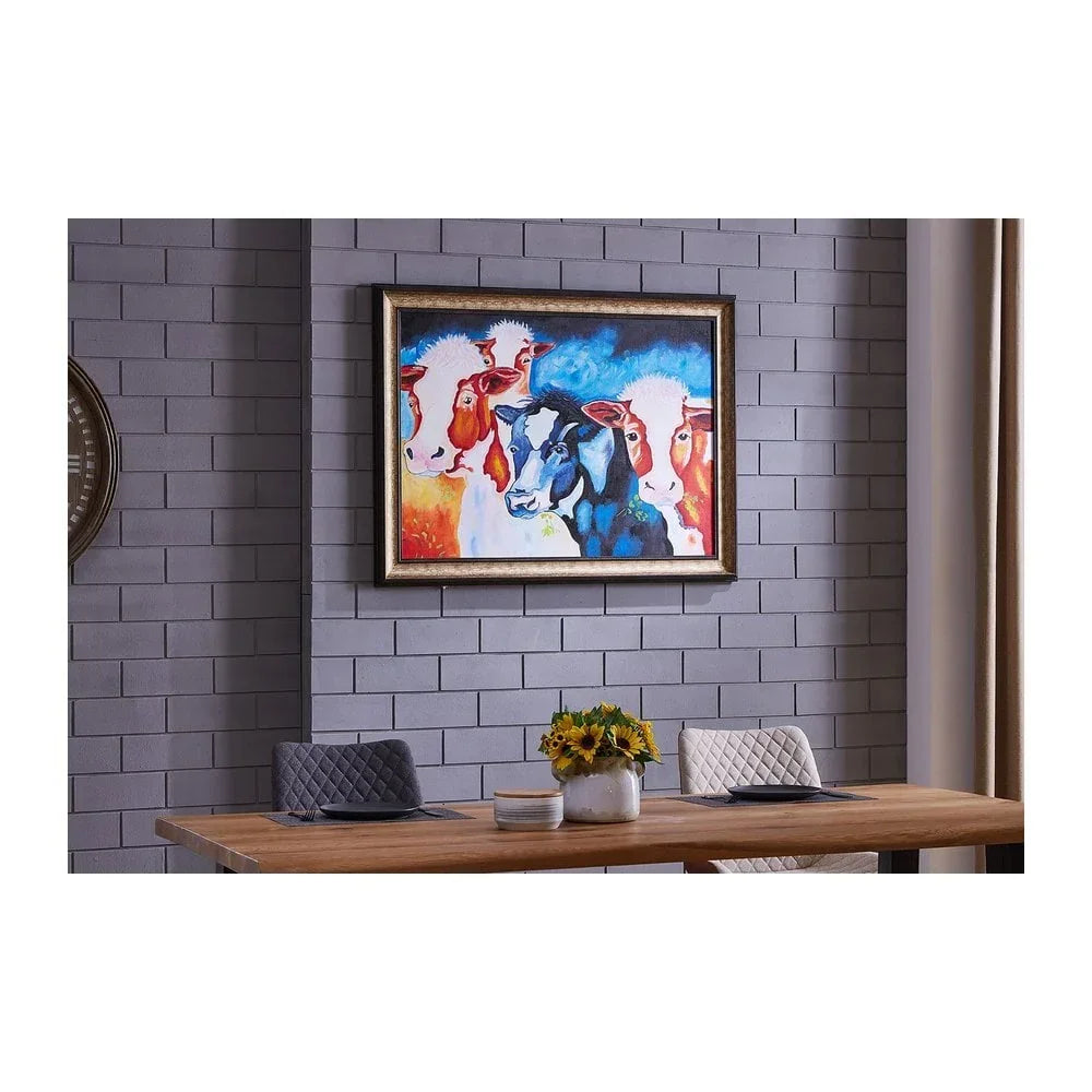 dining table with quilted chairs and framed cow print wall art on grey brick wall