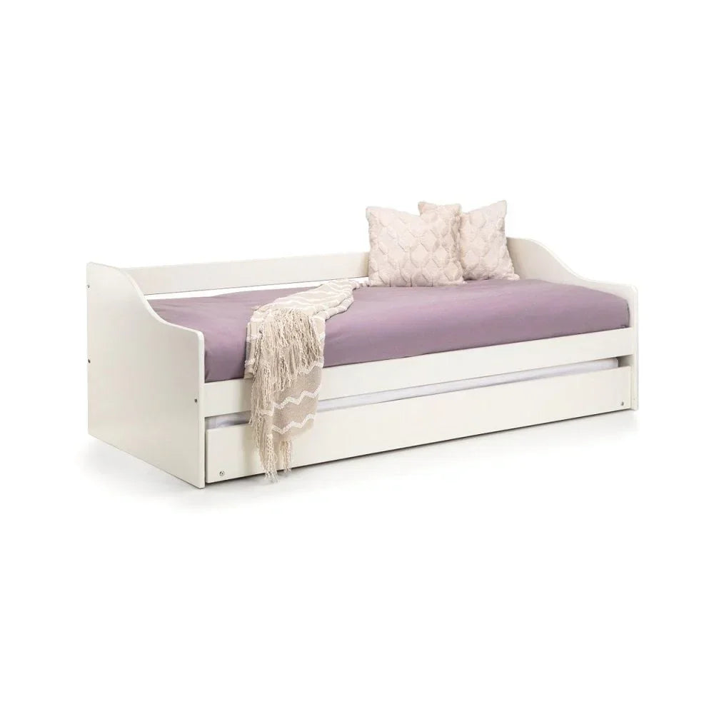 White wooden daybed with lavender mattress, underbed storage and decorative pillows
