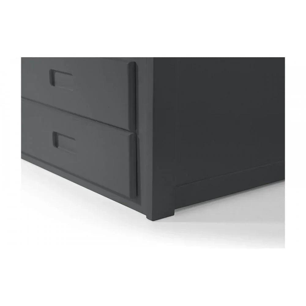 Close view of black wooden chest of drawers corner with recessed handles