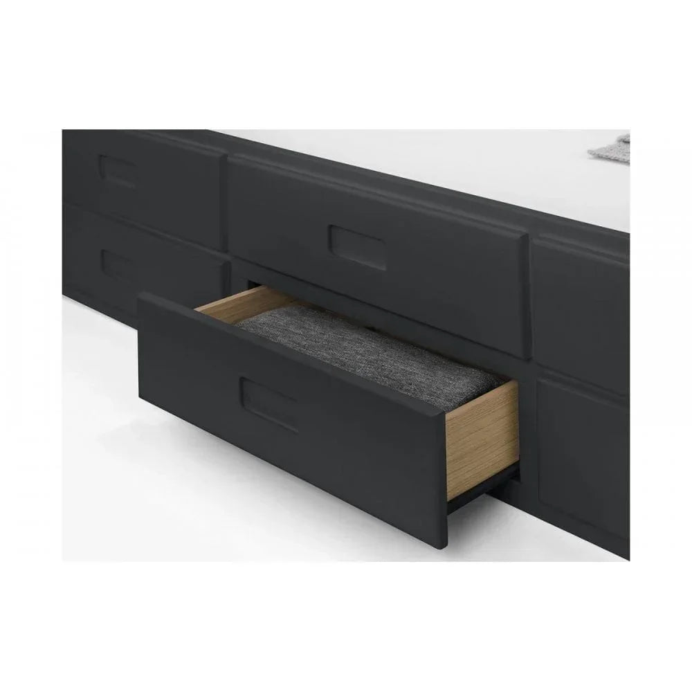 Black bed frame with storage drawer open showing folded grey blanket inside