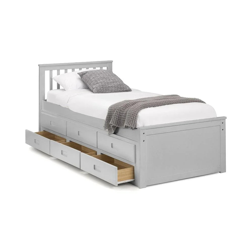 Single grey storage bed with three pull-out drawers, white bedding and grey blanket
