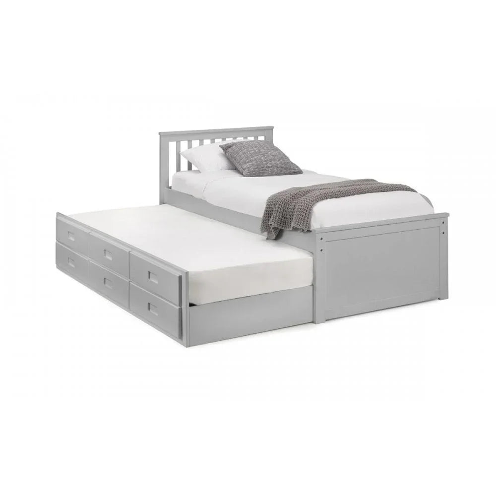 Grey wooden trundle bed with storage drawers and slatted headboard, side view