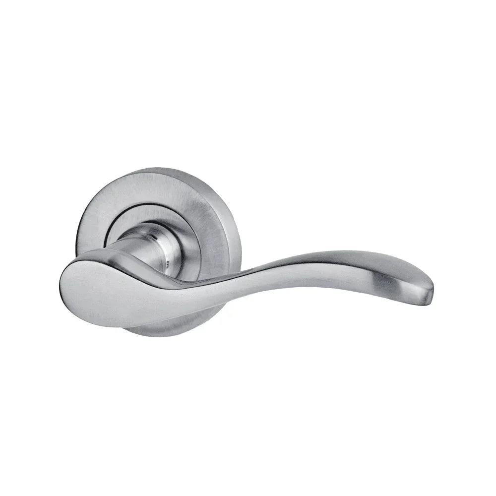Brushed chrome door handle with curved lever on circular backplate