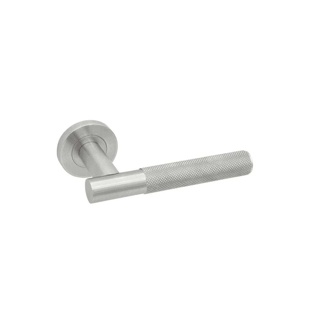 Brushed steel door handle with textured grip and round backplate, side view