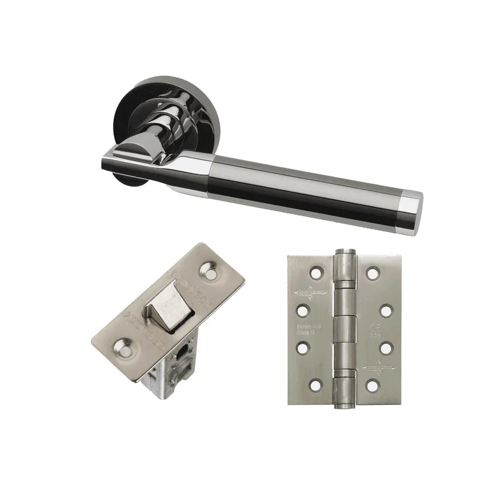 Chrome door handle set with latch and hinge hardware on white background